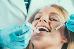woman receiving clear braces consult to help straighten teeth in Canyon Lake