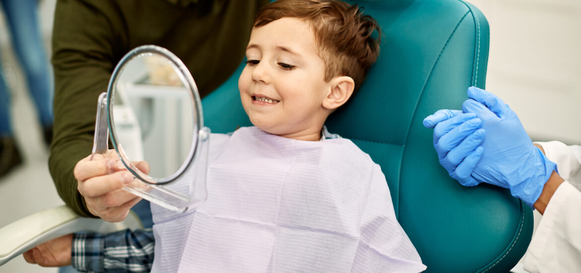 smiling boy in a modern dental office